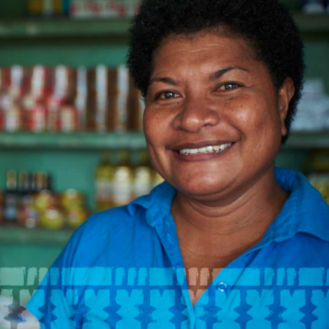The image is from the cover of the report; it shows a woman smiling with an out-of focus shelf with canned goods in the background.